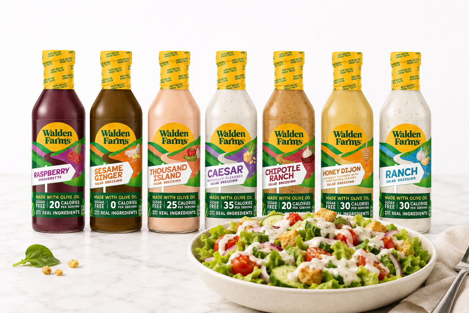 Six bottles of Walden Farms salad dressing arranged behind a bowl of mixed green salad on a light marble surface. The bottles are labeled Raspberry, Sesame Ginger, Thousand Island, Caesar, Dipotle Ranch, Honey Bison, and Ranch.