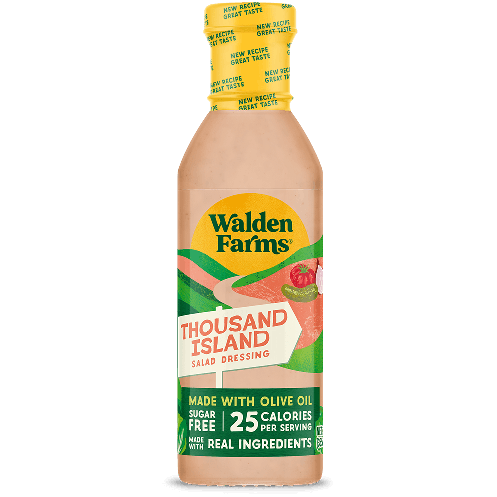 A bottle of Walden Farms Thousand Island Salad Dressing on a solid black background. The bottle contains a peach-colored dressing and features a yellow cap with a green and yellow label.