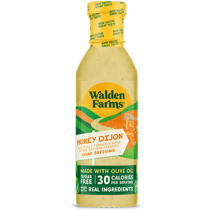 A bottle of Walden Farms Honey Dijon Salad Dressing on a solid black background. The bottle is filled with a pale yellow dressing and features a yellow cap, with a label displaying green, orange, and white graphics and text.